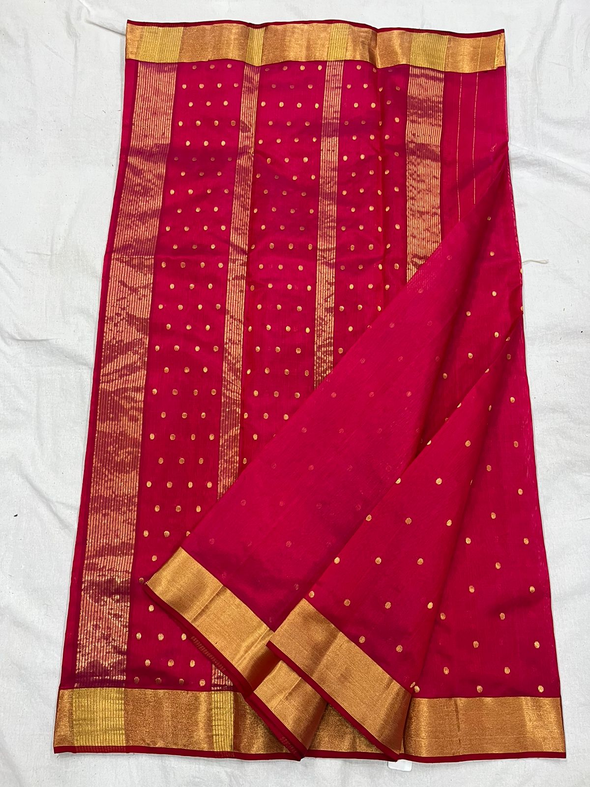 Pinkish red Chanderi saree with buti all over
