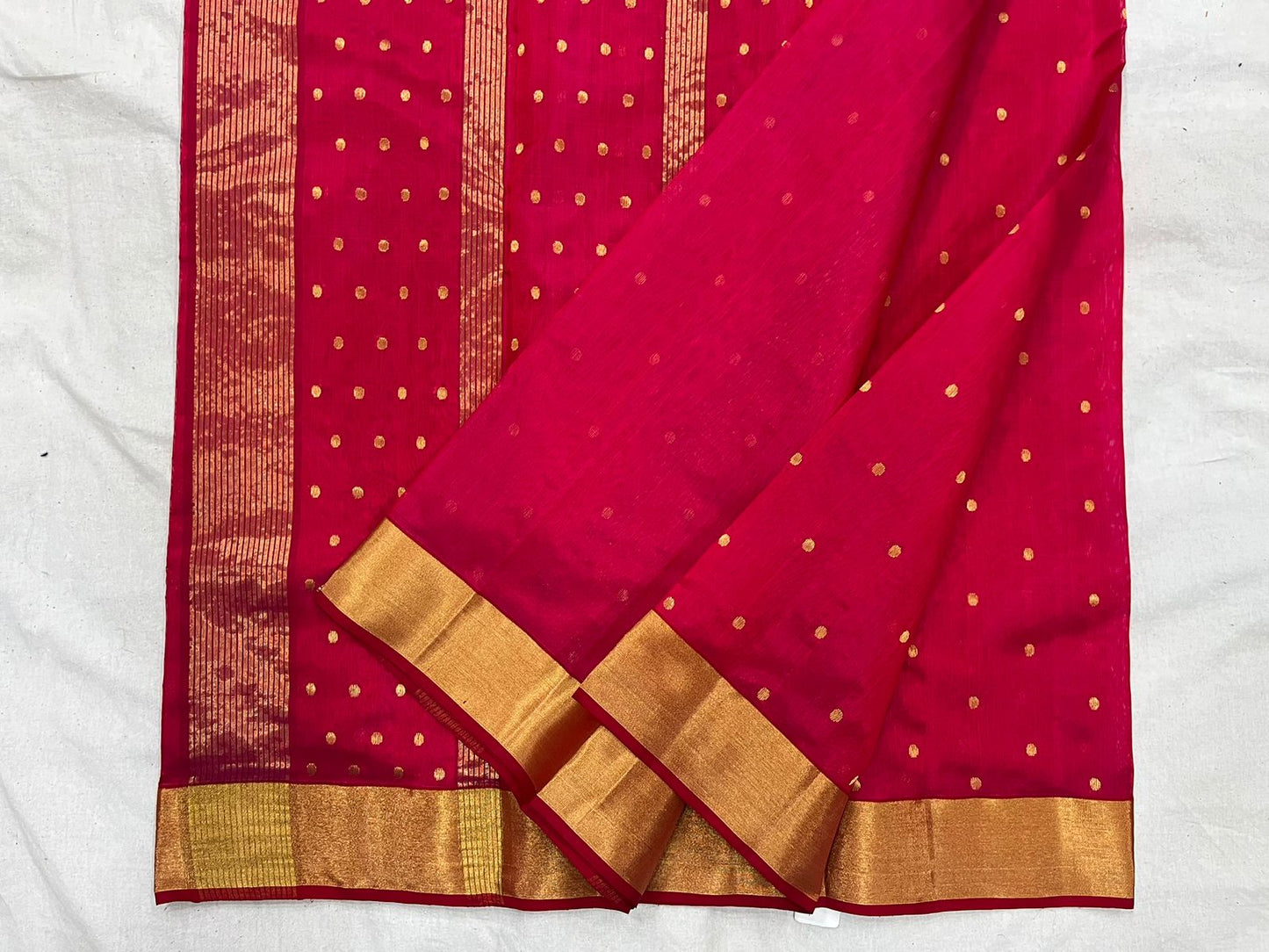 Pinkish red Chanderi saree with buti all over